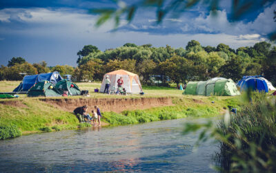 Riverside camping pitch, tent camping at Wild Canvas Camping, UK